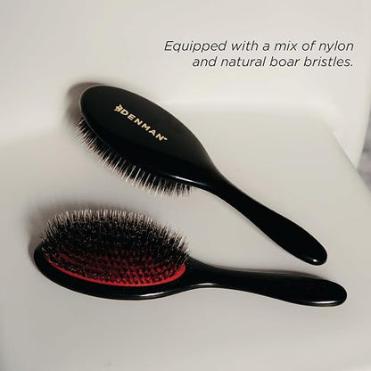 Two black hairbrushes with red accents on a white background, featuring the Denman brand.