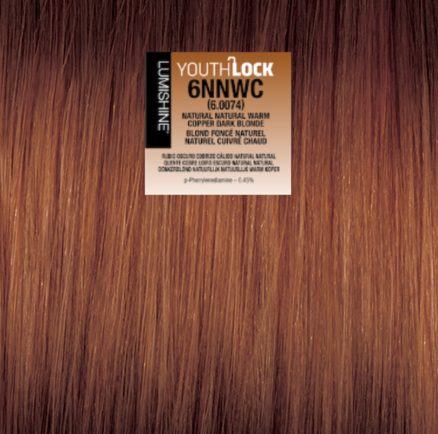 A close-up of brown hair extensions or a wig texture with a product label reading YouthLock 6NNWC and Lush Fine.