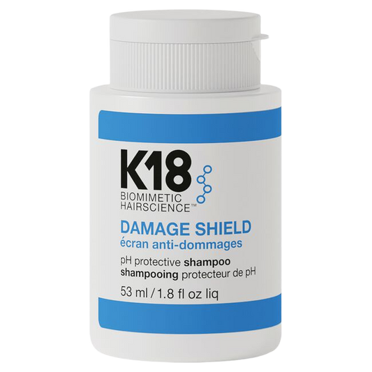 K18 Damage Shield shampoo bottle on a white background