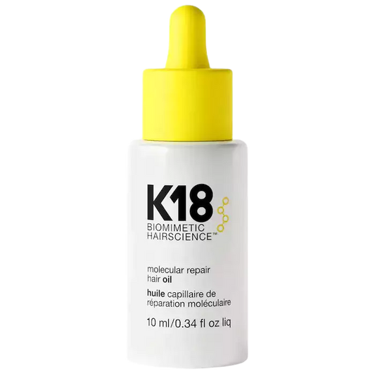 K18 hair oil bottle with yellow dropper on a white background