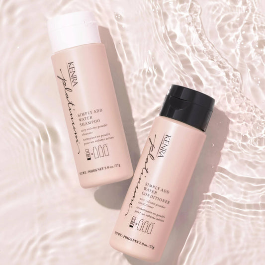Two bottles of shampoo and conditioner on a water surface