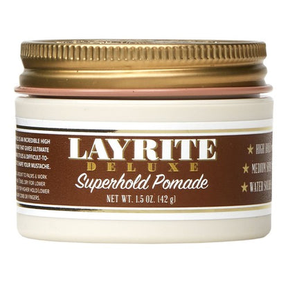 Jar of Layrite Deluxe Superhold Pomade with gold lid on a white background