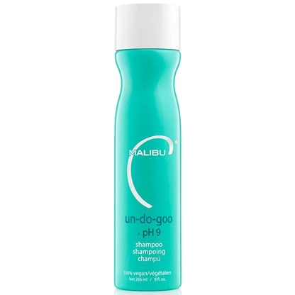 A bottle of Malibu Un-Do-Goo pH 9 shampoo, featuring a bright turquoise body and a white cap, set against a plain white background.