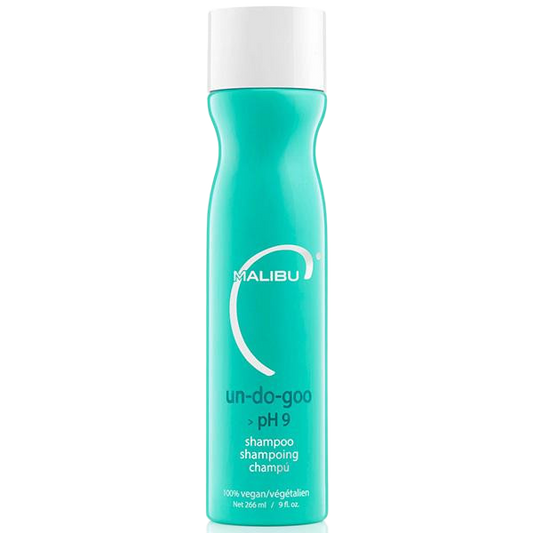 A bottle of Malibu Un-Do-Goo pH 9 shampoo, featuring a bright turquoise body and a white cap, set against a plain white background.