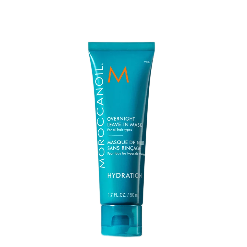 A turquoise Moroccanoil Overnight Leave-In Mask tube on a plain white background.