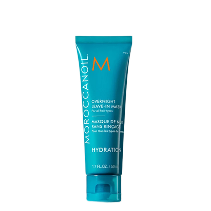 A turquoise Moroccanoil Overnight Leave-In Mask tube on a plain white background.