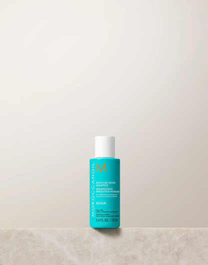 Blue bottle with white cap on a beige surface