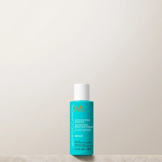 Blue bottle with white cap on a beige surface