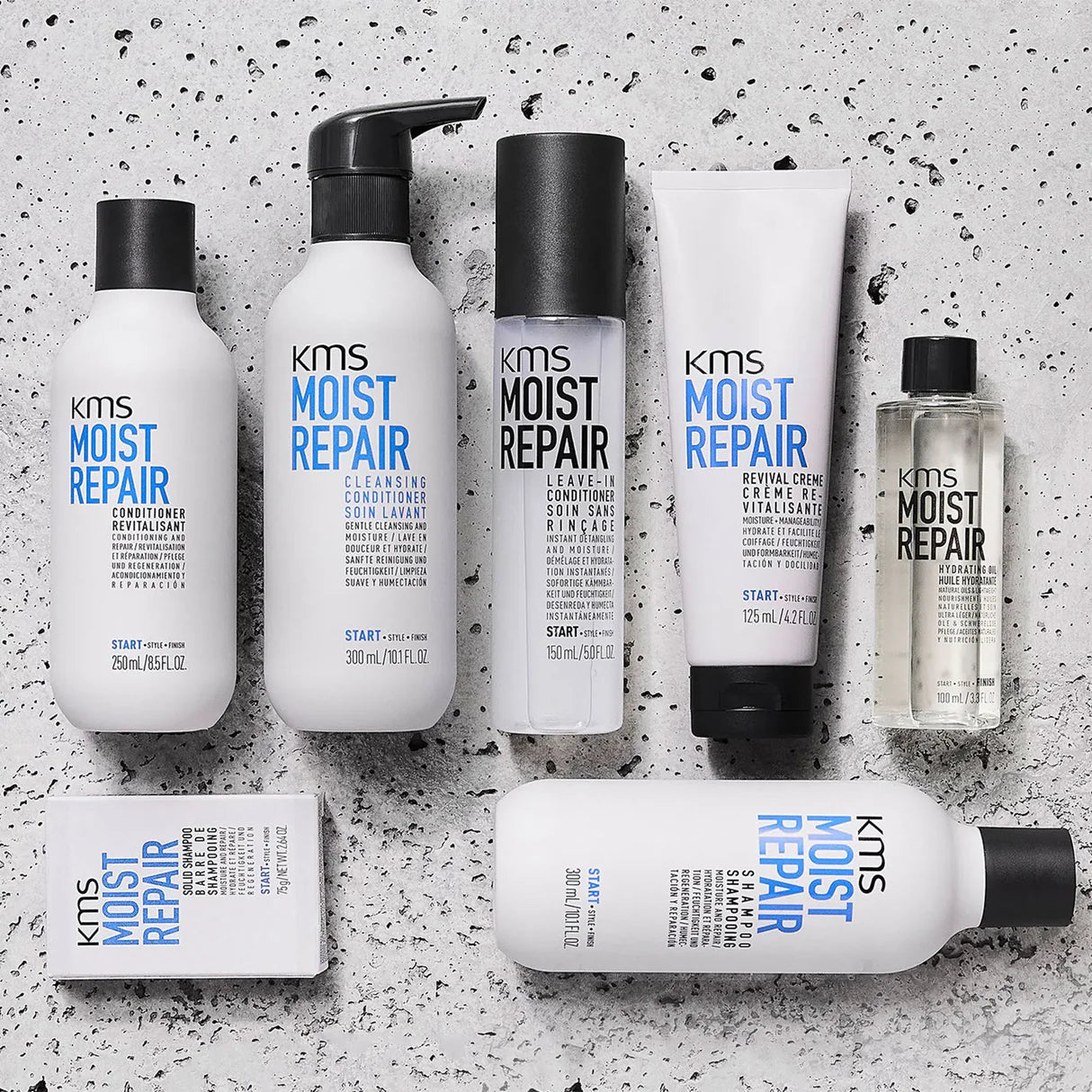 KMS Moist Repair hair care products on a textured gray background