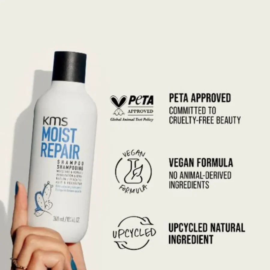 KMS Moist Repair shampoo bottle with PETA approval and vegan formula labels on a light background