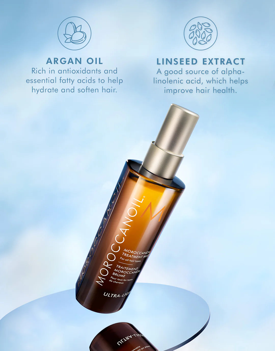 Moroccanoil hair treatment bottle with argan oil and linseed extract text on a light blue background