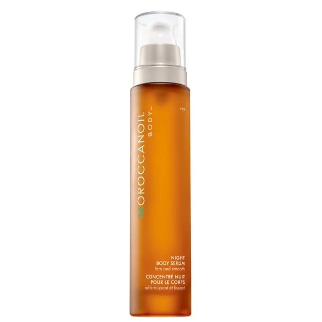 Moroccanoil Body+ Night Body Serum in an amber orange bottle with a clear cap and white pump, shown on a plain white background.