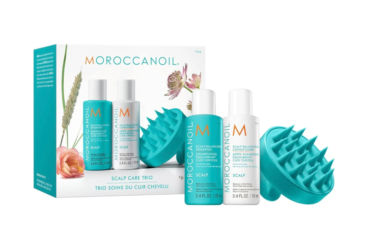 Moroccanoil scalp care products including bottles and a box on a white background