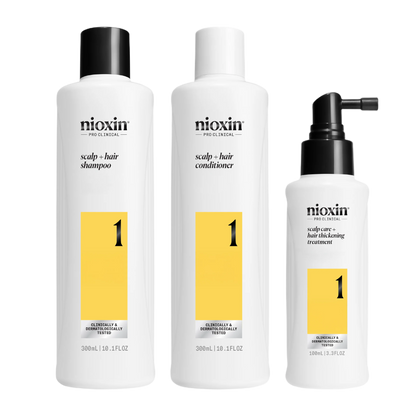Three Nioxin hair care products on a white background