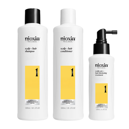Three Nioxin hair care products on a white background