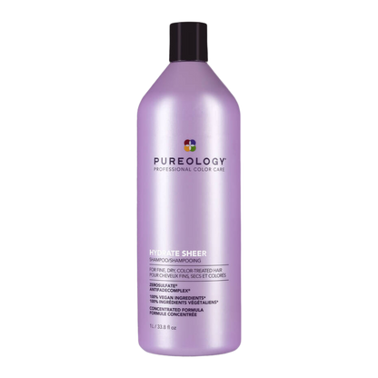 Purple shampoo bottle with black cap on a white background