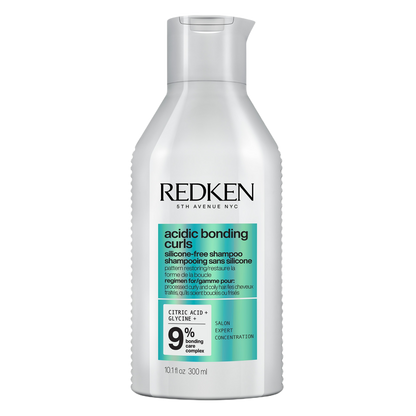 Redken acidic bonding curl shampoo bottle on a white background