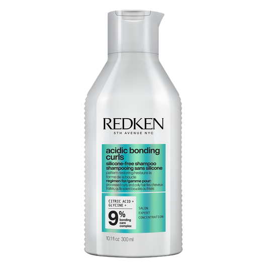 Redken acidic bonding curl shampoo bottle on a white background