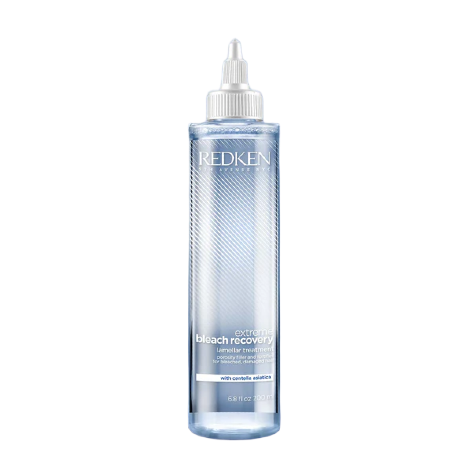 Redken bleach recovery bottle on a white background