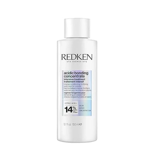 Redken bottle of acidic bonding concentrate on a white background