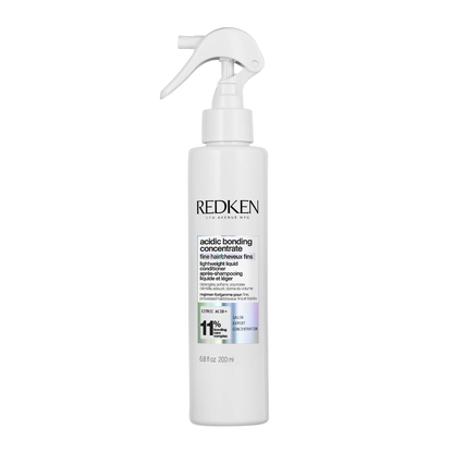 Redken bottle with a white background
