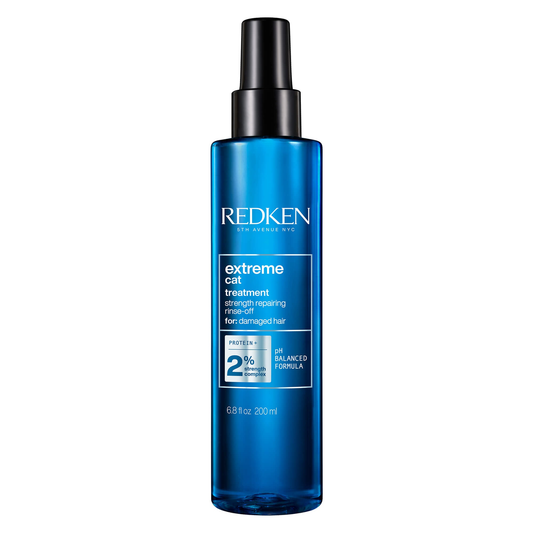 Redken extreme cat treatment bottle on a white background