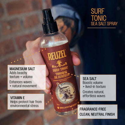 Reuzel Surf Tonic Sea Salt Spray bottle held by a person with product details on a blurred background.