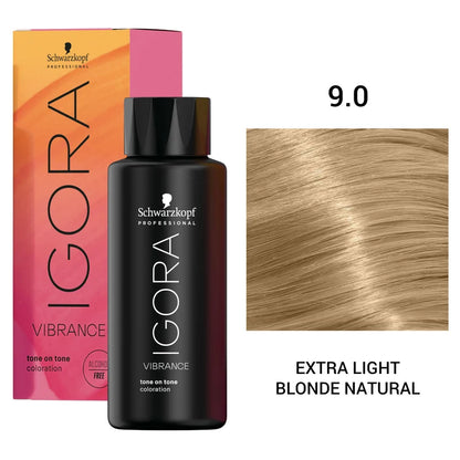 Schwarzkopf Professional Igora Vibration tone on tone coloration bottle in shade 9.0 Extra Light Blonde Natural, shown with its pink-to-orange box and a hair color swatch on a white background.