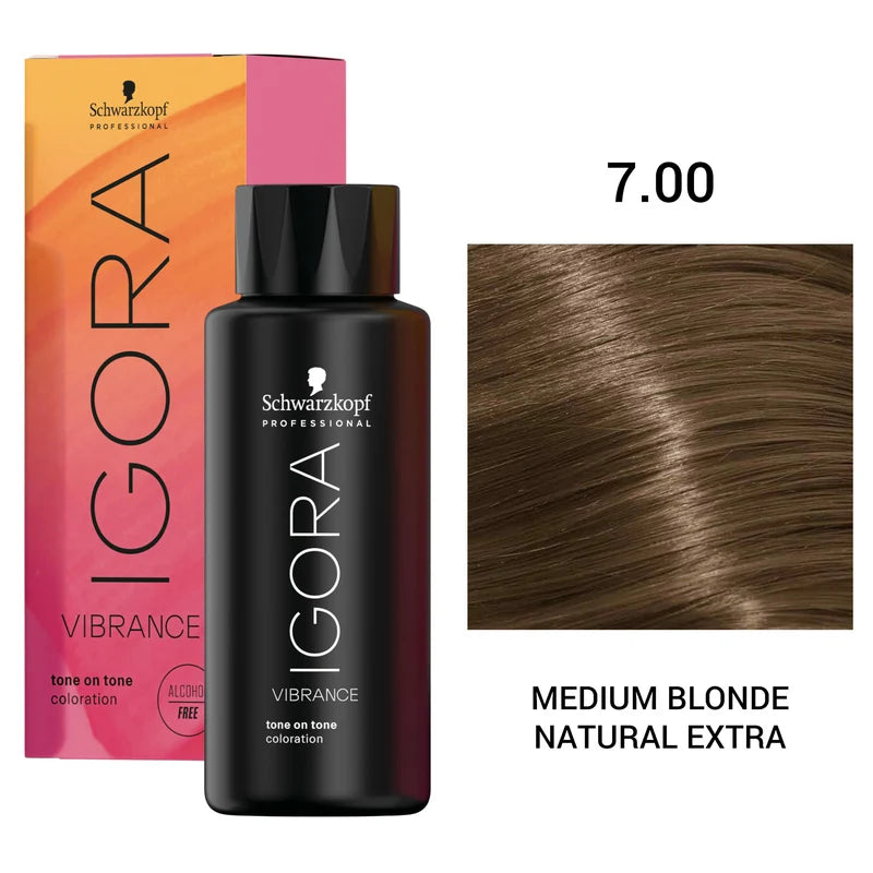 Schwarzkopf Professional Igora Vibrance tone-on-tone color treatment bottle in shade 7.0 Medium Blonde Natural Extra, shown with its pink and orange box and a hair swatch on a white background.