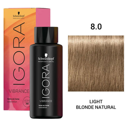 Schwarzkopf Professional Igora Vibrance tone on tone coloration bottle in shade 8.0 Light Blonde Natural, shown with its pink and orange box and a hair color swatch on a white background.