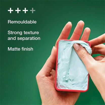 Hand holding a red container with green substance, against a green background with text about product features.