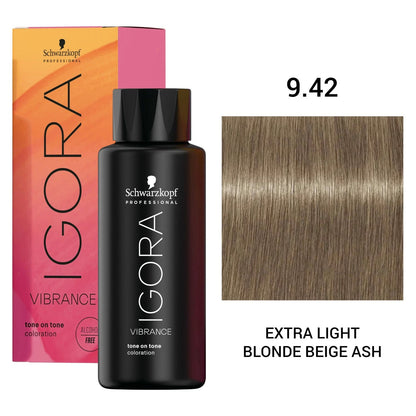 Schwarzkopf Professional Igora Vibrance hair color bottle in front of its pink and orange box, with a hair color swatch labeled '9.42' and the shade name 'EXTRA LIGHT BLONDE BEIGE ASH'.