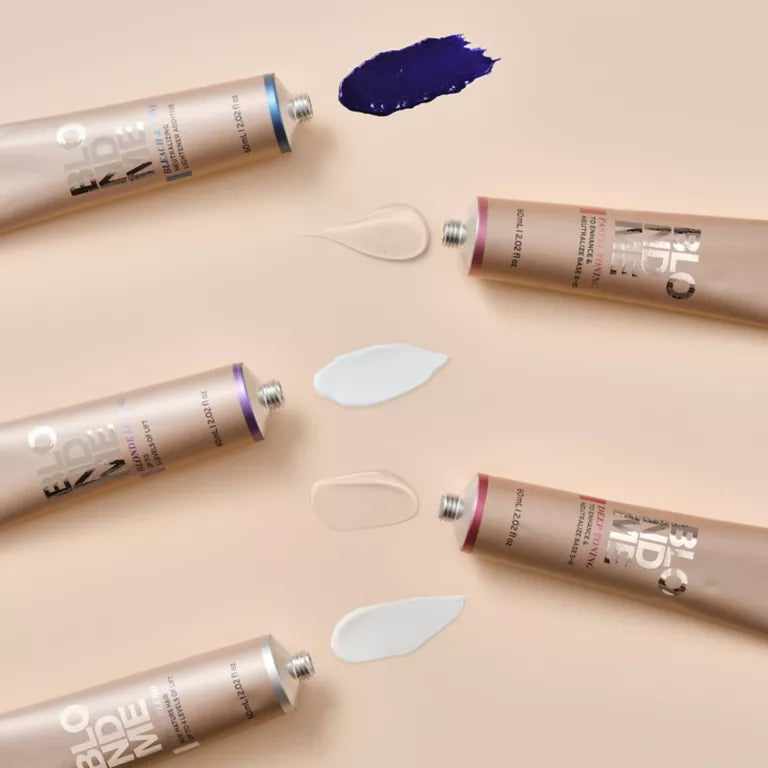 Multiple tubes of BB cream on a beige background with visible product swatches.