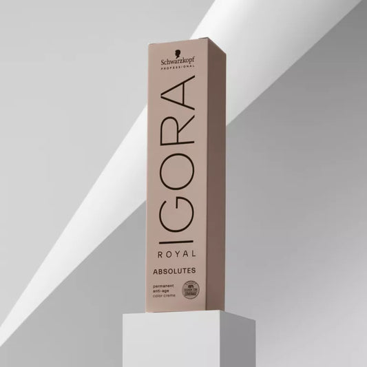 Schwarzkopf Igora Royal Absolutes hair color box on a white pedestal with a gray background