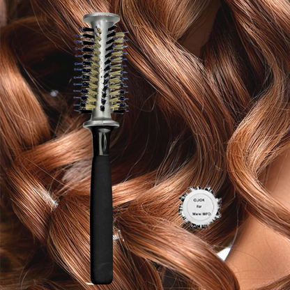 Hotheads Speed Hairbrush with black handle and round bristle head on wavy hair background