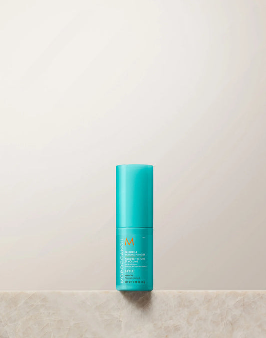 Turquoise bottle with a logo on a light beige background
