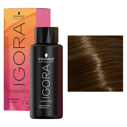 Schwarzkopf Professional Igora Vibrance tone on tone color treatment bottle in front of its pink and orange box, with a hair swatch showing the dark brown highlighted result on the right.