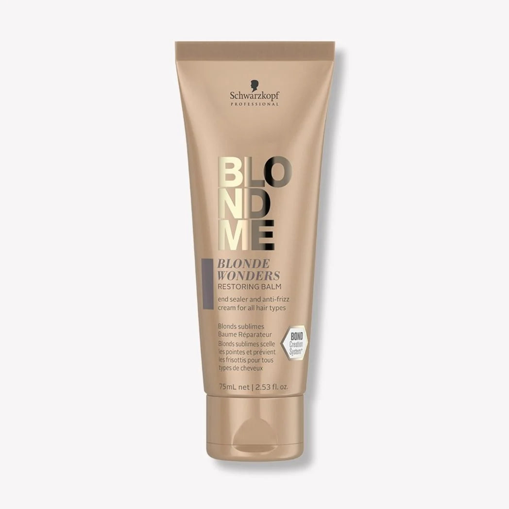 Schwarzkopf Professionals Blonde Wonders Restoring Balm in a 70ml squeeze tube, featuring a metallic beige design with black and gold lettering, set against a light gray background.