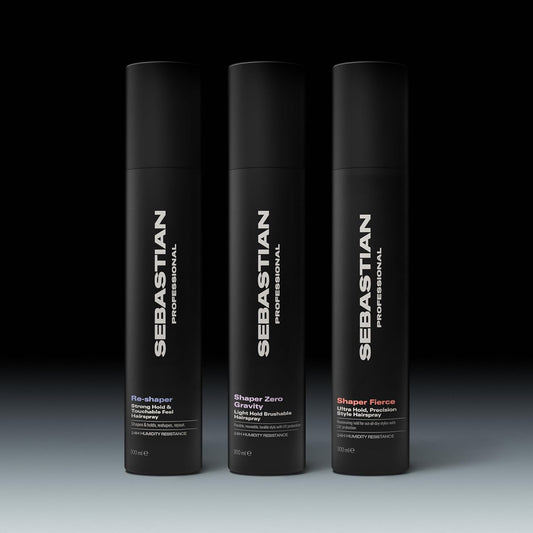 Three different bottles of Sebastian Professional hair products on a gradient background