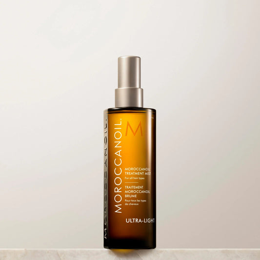 Moroccanoil hair treatment bottle on a light background