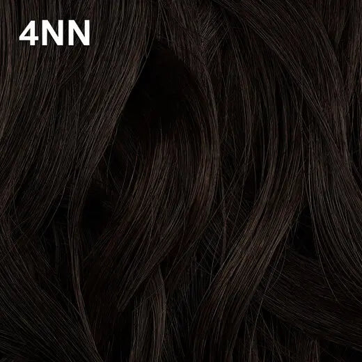 Close-up of dark brown hair with Wella Color Charm  '4NN' label