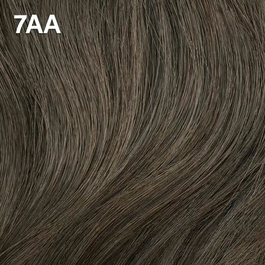 Wella Color Charm Permanent Liquid Color close-up of brown hair extensions with '7AA' label