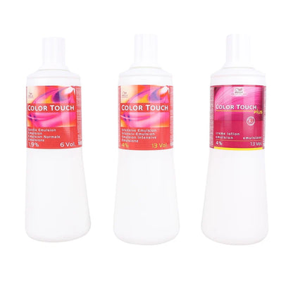 Three white bottles of Color Touch hair developer in 6 Vol, 13 Vol, and 13 Vol+ sizes, arranged side-by-side on a plain white background.