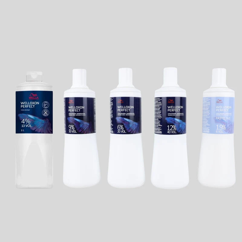 Five bottles of Wellwood Perfect aquarium water conditioner arranged in a row against a light gray background. The bottles are white with dark blue and purple labels showing different concentrations from 4% to 12% and 1.