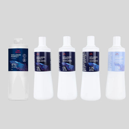 Five bottles of Wellwood Perfect aquarium water conditioner arranged in a row against a light gray background. The bottles are white with dark blue and purple labels showing different concentrations from 4% to 12% and 1.