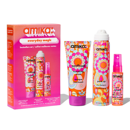 Amika hair care product set with colorful packaging on a white background