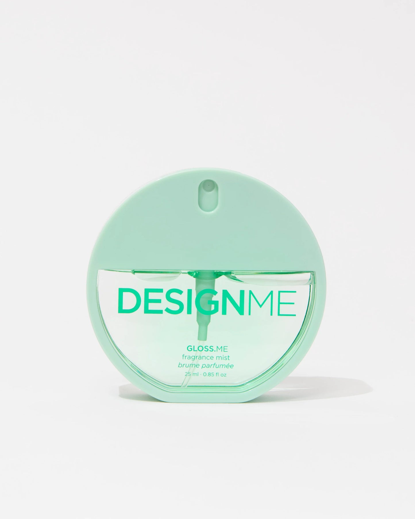 A mint green round bottle of DESIGN ME Gloss Me fragrance mist on a clean white background.