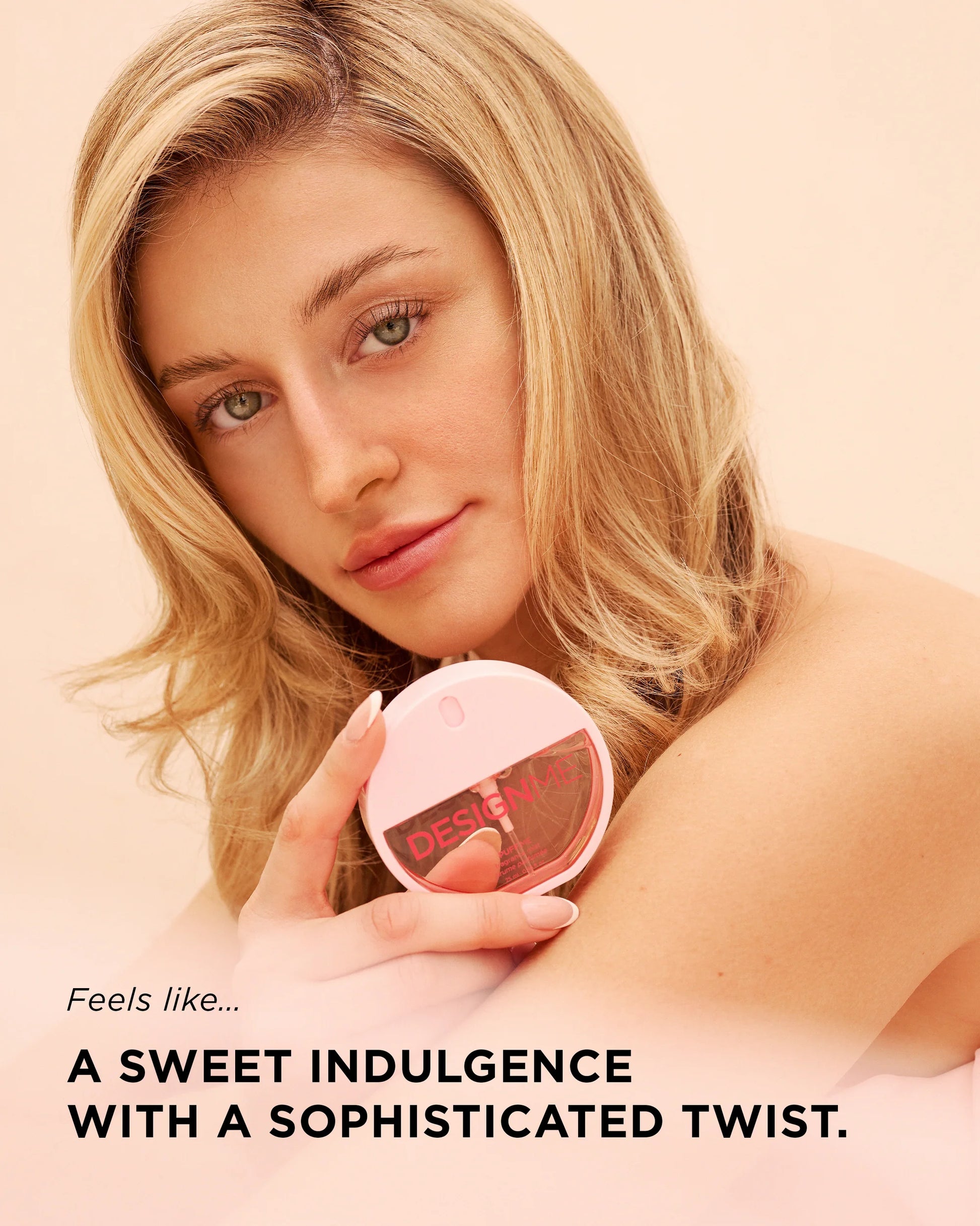 A blonde woman holding a round pink compact mirror with the brand name 'desire' visible on the lid, set against a soft peach background with promotional text at the bottom.