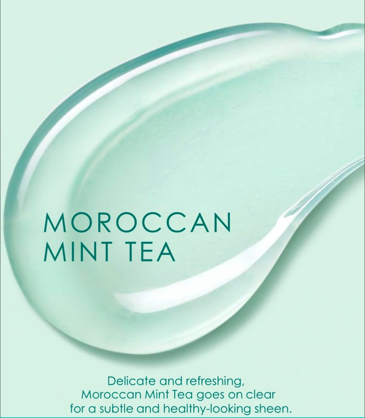 Close-up of a drop of clear liquid with 'Moroccan Mint Tea' text on a light green background.