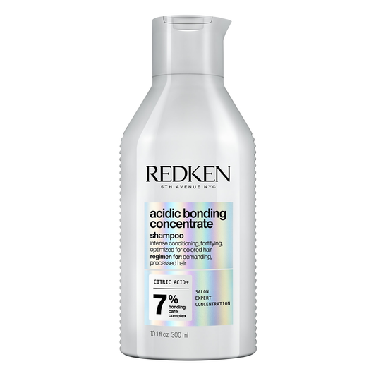 Redken acidic bonding concentrate shampoo bottle on a white background